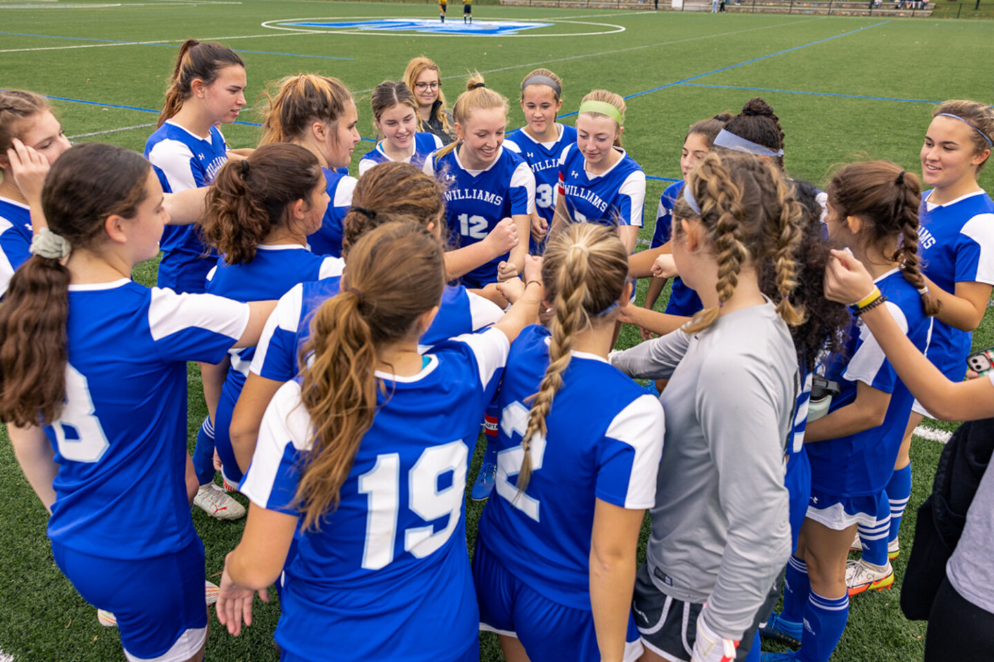 Girls soccer players in a huddle