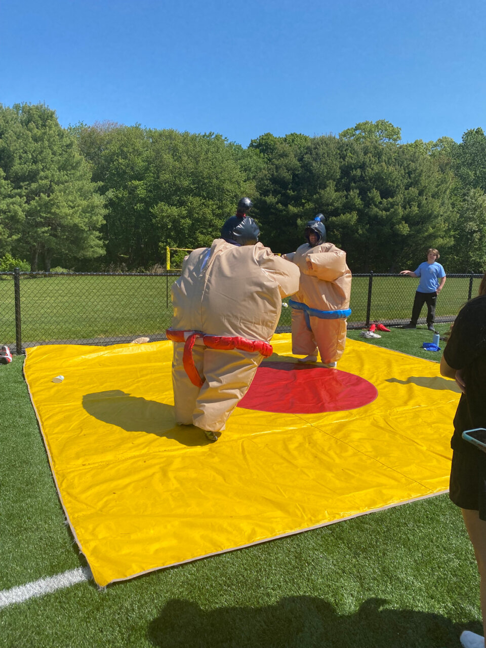 Williams Students sumo wrestle in inflatable plastic suits for senior day